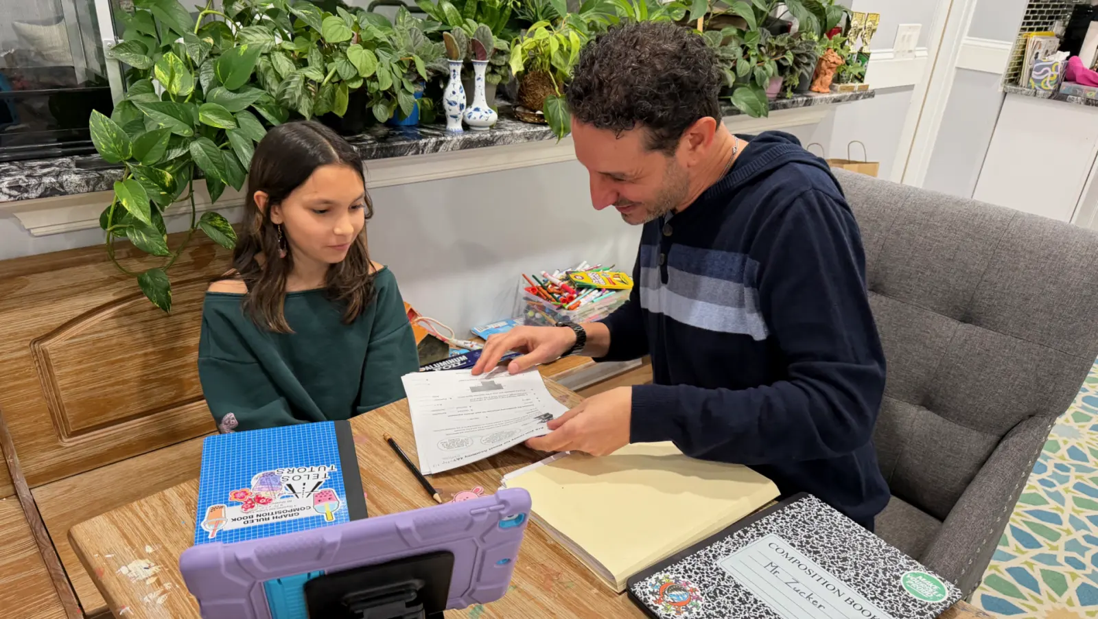 A Telos Tutors instructor working one-on-one with a student